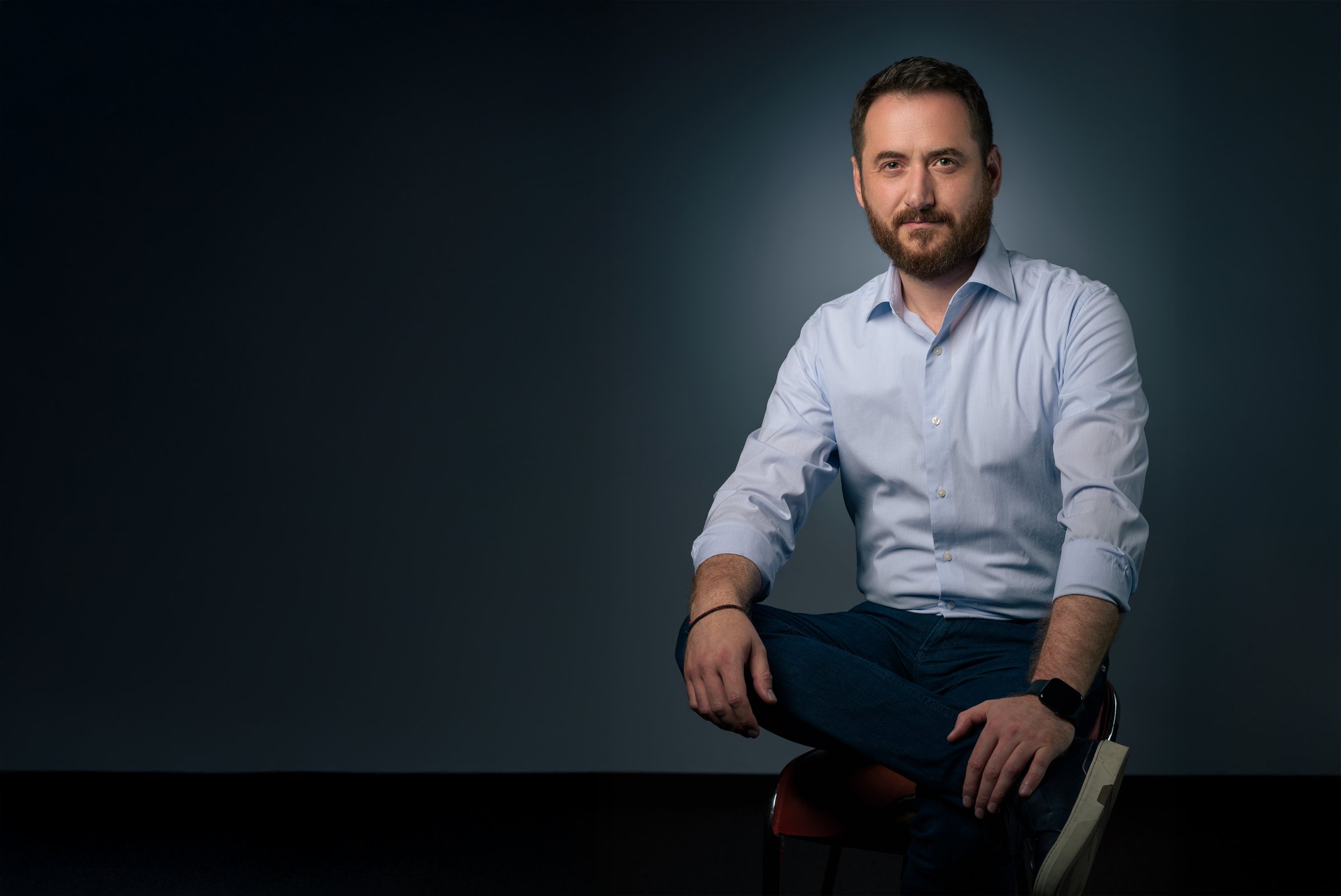 Iulian Chiriac, founder of Mekanys, seated portrait